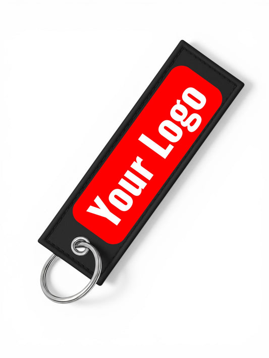 One Touch Hold black faux leather keychain with a red rectangle and white "Your Logo" text.